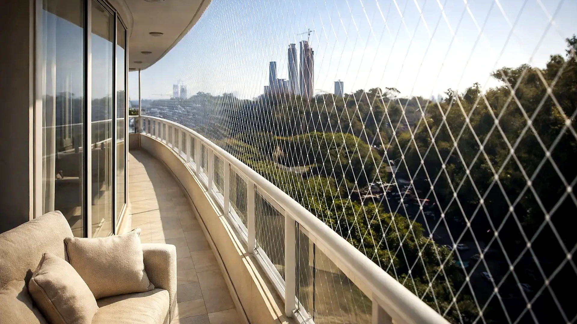 Transparent balcony safety net covering a high-rise apartment opening